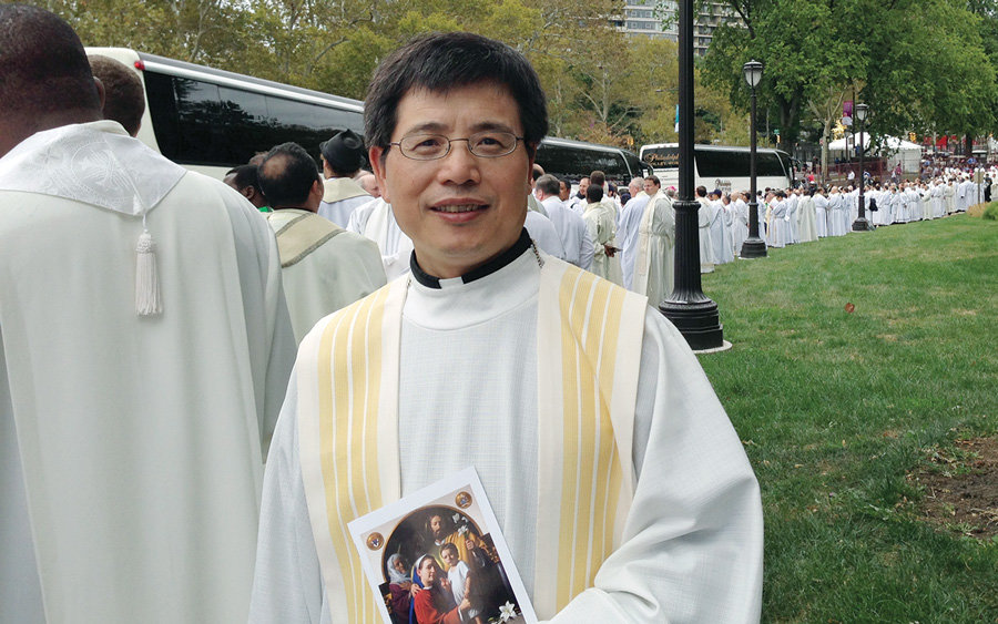 While studying at Catholic University of America, Father John Chen concelebrated Mass with Pope Francis in Philadelphia last year (Courtesy of J. Chen/U.S.)