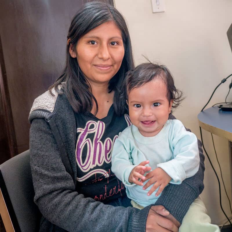 Solidarity bridge: Roxana Mamani holds her daughter Ailee, who was diagnosed with a congenital heart disease. (Nile Sprague/Bolivia)