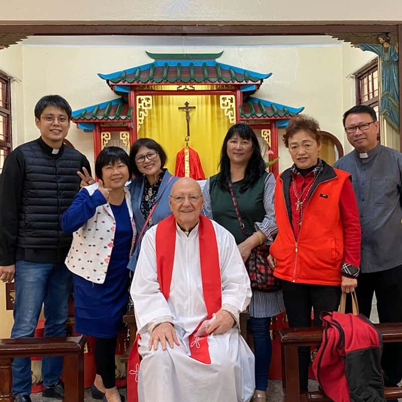 Father Murray (center) smiles with parishioners and priests in residence after Mass at Our Lady of China Church in Taichung.(Courtesy of Our Lady of China Church/Taiwan)