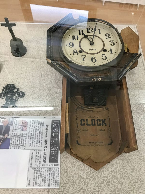 A broken clock stopped by the Aug. 9, 1945, atomic bombing of Nagasaki, Japan, as well as a burned cross and rosary are pictured at the Urakami Kirishitan Museum in Nagasaki, Japan, Aug. 29, 2017. (CNS photo/Mihoko Owada)