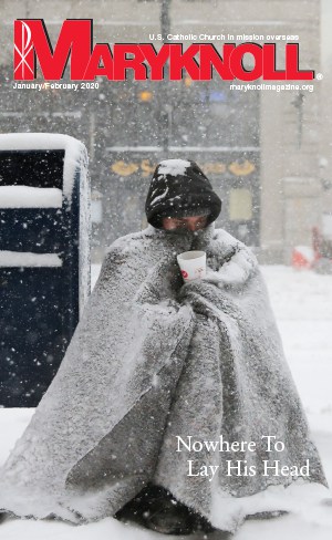 A homeless man appeals for money during blizzard-like conditions in Boston. CNS/Brian Snyder, Reuters/U.S.