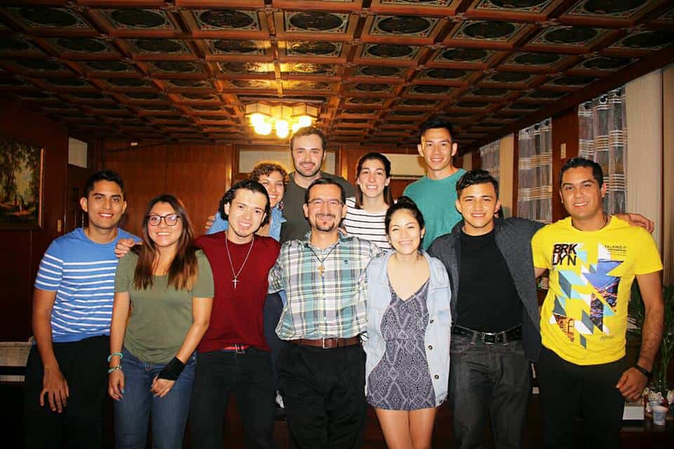 Maryknoll Father Rodrigo Ulloa, center front, and the Fishers of Light group at a meeting at the Maryknoll house in Taipei.