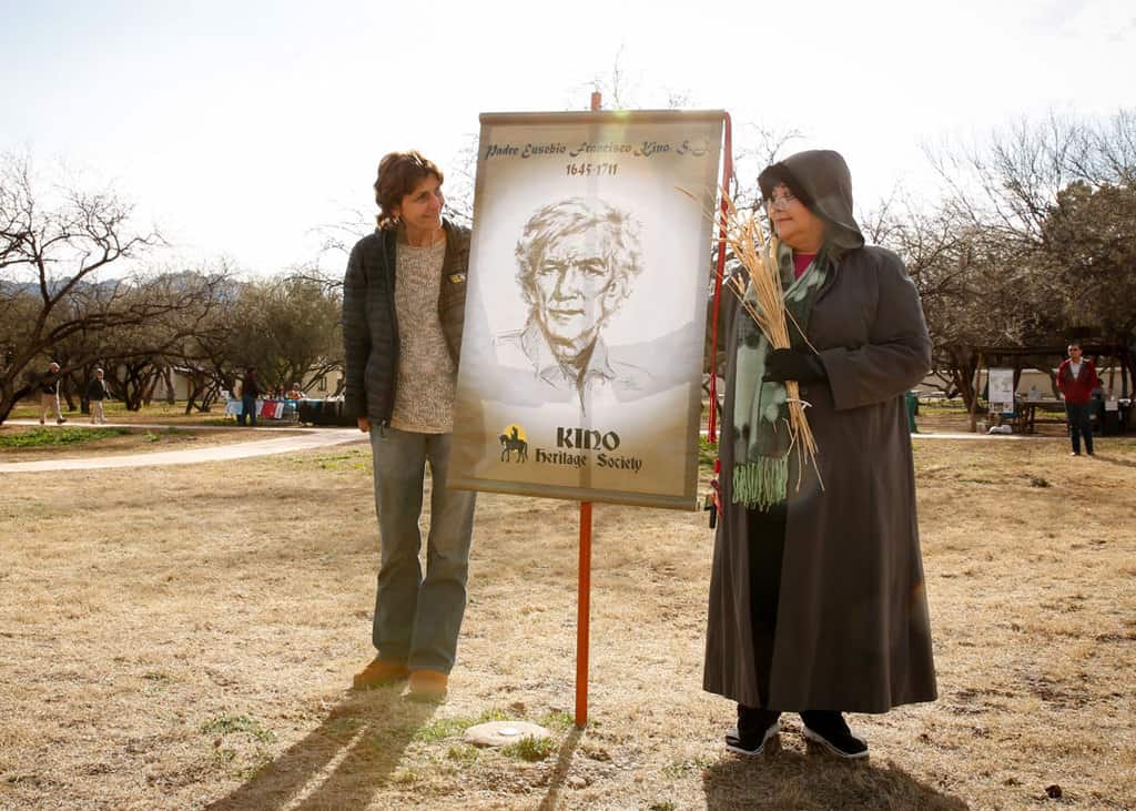 In this 2016 file photo, Carmen Dolny and Rosie Garcia, display a banner showing an image of Jesuit Father Eusebio Francisco Kino at the Tumacacori National Historical Park in Tumacacori, Ariz. Garcia is president of the Kino Heritage Society, a Tucson, Ariz.-based society working to promote the missionary priest's cause in the United States. (CNS photo/Nancy Wiechec)
