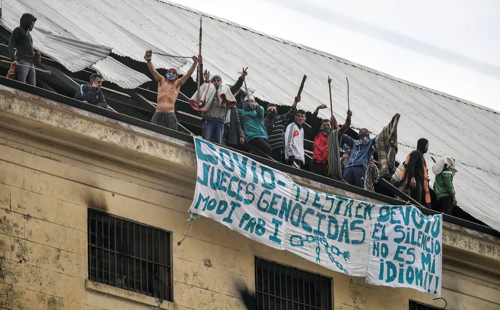 Prisoners protest in late April on the roof of the Devoto prison in Buenos Aires, Argentina, demanding action on overcrowding during the COVID-19 pandemic. (CNS photo/Victor Carreira, Latin America News Agency via Reuters)