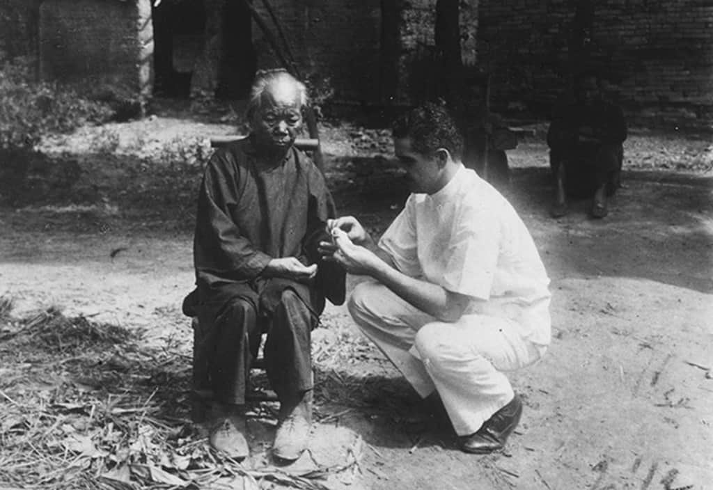 Dr. Harry Blaber with a patient at the leprosarium in Xinhui. (Maryknoll Mission Archives)