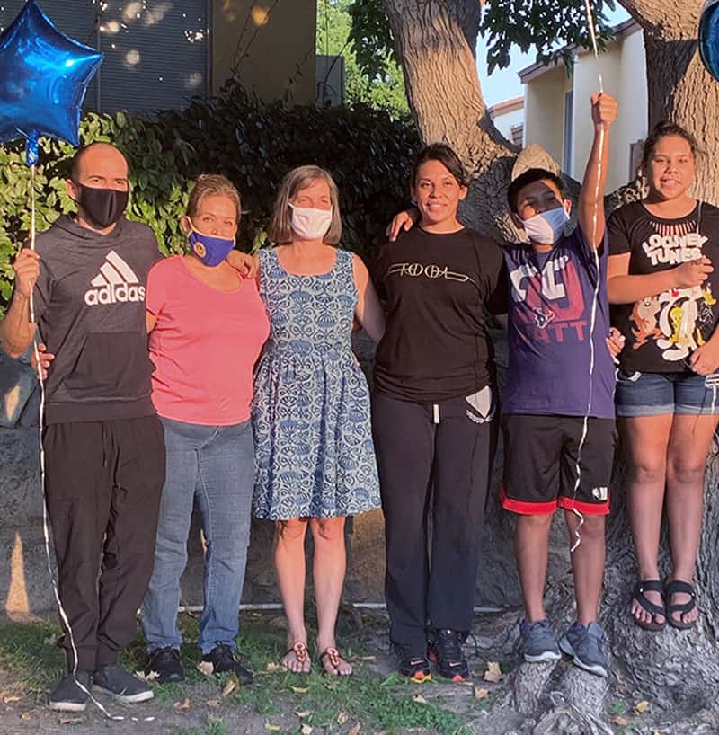 Elizabeth (third from right) is finally home with her family and Heidi Cerneka (Courtesy of MKLM)