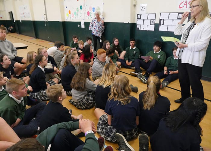 MDI-school-2 Sandra Barton Smith, of the Seattle Archdiocese, shares what it means to be a missionary disciple beyond middle school, as teacher Mari Halley looks on. (Peter Saunders/U.S.)