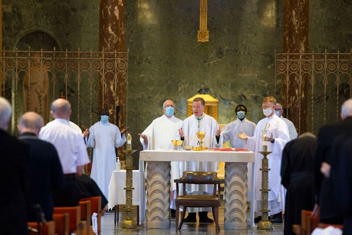 Bishop Edmund J. Whalen of New York (center) during the consecration at Gregory McPhee's ordination Mass, held at Our Lady of the Apostles Chapel in Maryknoll, N.Y. (Octavio Duran/U.S.)