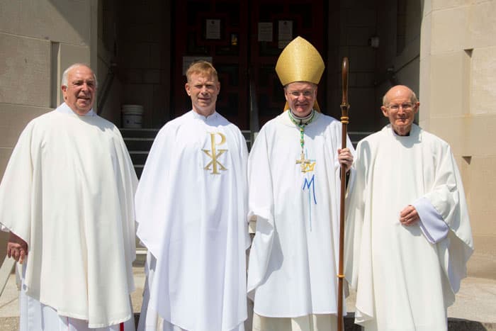 From left to right: Maryknoll Superior General Raymond Finch, newly-ordained Maryknoll Father Gregory McPhee, Auxiliary Bishop Edmund J. Whalen, and Maryknoll Father Russell Feldmeier, following the priestly ordination of Gregory McPhee, August 22, 2020, at Maryknoll, N.Y. (Octavio Duran/U.S.)