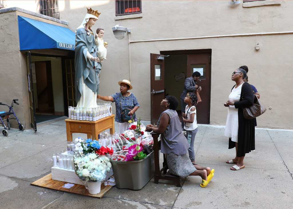 Before the quarantine and trauma of COVID-19, Father Dennis Moorman distributed Holy Communion at Mass at St. Joseph Church in Peruas, Sao Paulo, Brazil. (Nile Sprague/Brazil)