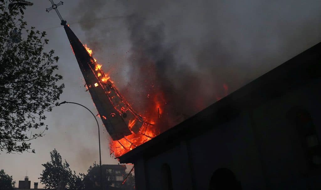 Protesters burn churches in Chile over inequality
