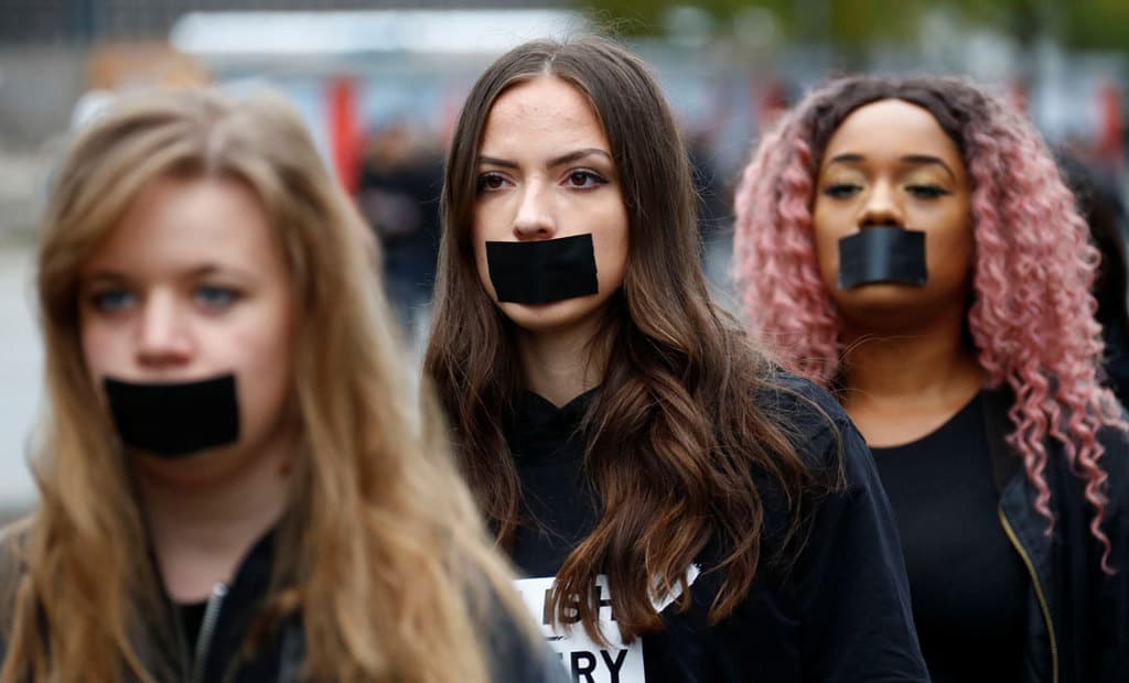 Activists in Berlin take part in a "Walk for Freedom" to protest human trafficking in 2018. Caritas Internationalis issued a statement July 28, 2020, that said insufficient attention "was paid on the collateral damage of the ongoing pandemic, especially on migrants and informal workers, who are now more exposed to trafficking and exploitation." (CNS/Fabrizio Bensch, Reuters)