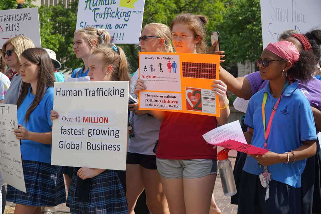 A group including students from Sacred Heart Academy and Presentation Academy in Louisville, Ky., listen to a speaker during the seventh annual prayer service for the victims of human trafficking in 2019 at Jefferson Square Park in downtown Louisville. A Vatican representative said the protection of rights and human dignity is not exclusive to the wealthy but also to the most vulnerable, especially victims of human trafficking. (CNS/Ruby Thomas, The Record)