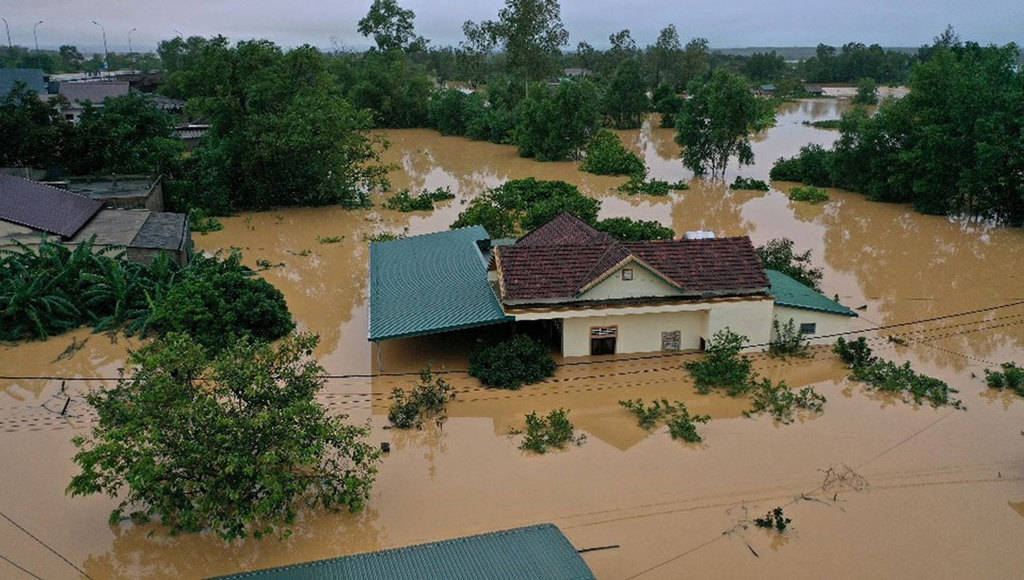 Floodwaters surround a home in Vietnam's province of Quang Tri Oct. 18, 2020. Two dioceses in central Vietnam hit by some of the worst floods in the country’s history are struggling to provide emergency aid for hundreds of thousands of victims. (CNS/Ho Cau, VNA handout via Reuters)