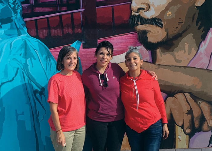 Elizabeth is flanked by her attorney, Maryknoll Lay Missioner Heidi Cerneka (left), and paralegal Connie Lara. (Courtesy of Heidi Cerneka/U.S.)