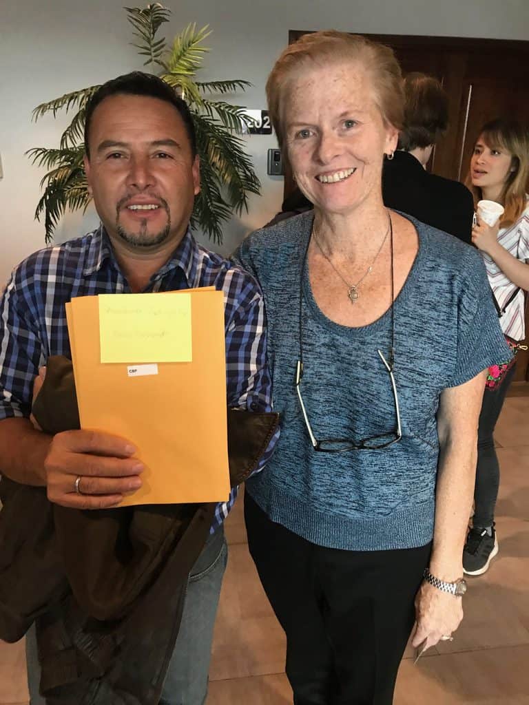 Fernando, who fled with his family to the United States after his son was murdered by a gang in Guatemala and the rest of hs family threatened, meets with Linda Dakin-Grimm in Guatemala. He was later allowed to return to the United States to pursue his asylum case. (Beth Baltimore photo/Guatemala)