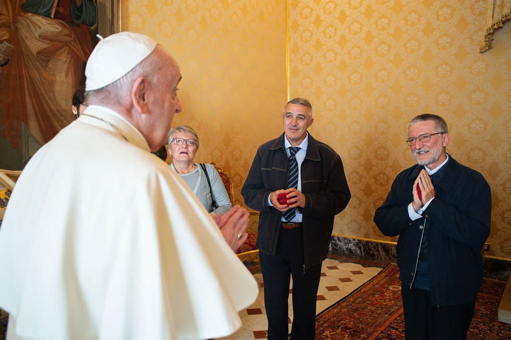 Pope Francis meets Father Pierluigi Maccalli, right, and members of the priest's delegation at the Vatican Nov. 9, 2020. Italian Father Maccalli, a priest of the Society of African Missions, and three other hostages were released Oct. 8 after being kidnapped and held for more than two years in Niger and Mali. (CNS/Vatican Media)