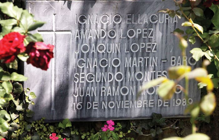 Stone with the names of six slain Jesuits marks the spot where they were killed by government soldiers in the midst of the 12-year Salvadoran civil war. (John Spain/El Salvador)