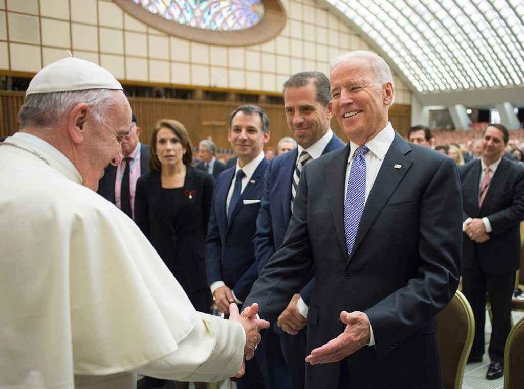 Pope Francis greets then-Vice President Joe Biden after both spoke at a conference on adult stem cell research at the Vatican in this April 2016, file photo. News organizations have projected that Biden will be the 46th president of the United States, making him the second Catholic in the country's history to be elected to the nation's highest office. With asylum-seekers story. (CNS/L'Osservatore Romano)