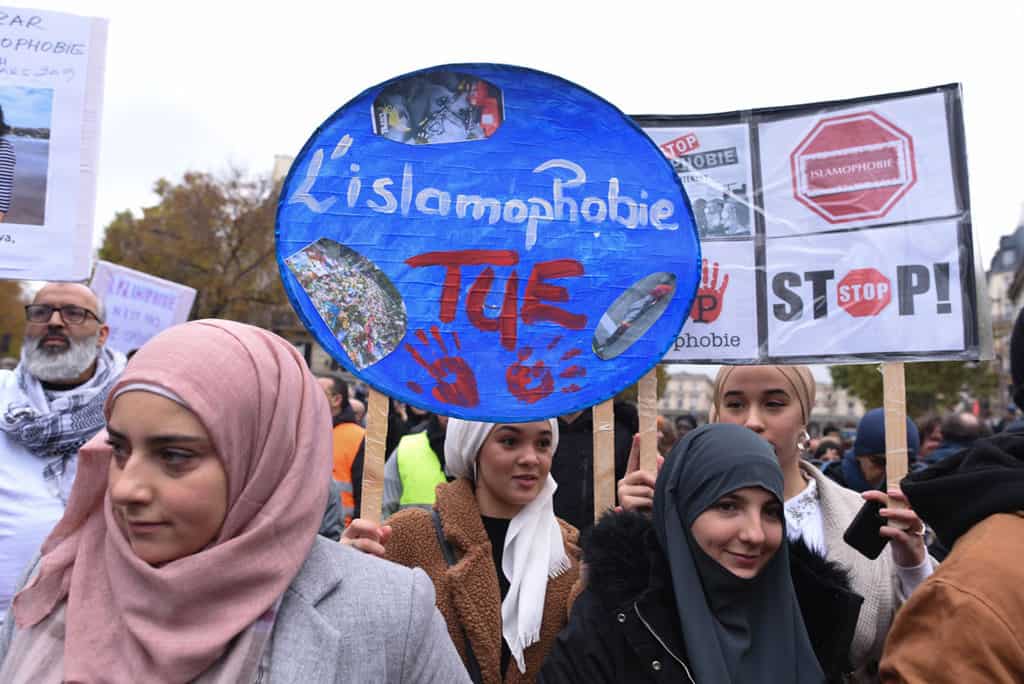 People in Paris march against islamophobia Nov. 10, 2020, two weeks after an attack against a mosque in Bayonne and a rise in what activists allege is anti-Islam scaremongering and hostility among French leaders. The placard reads "Islamophobia Kills." (CNS/Mehdi Chebil, Hans Lucas via Reuters)