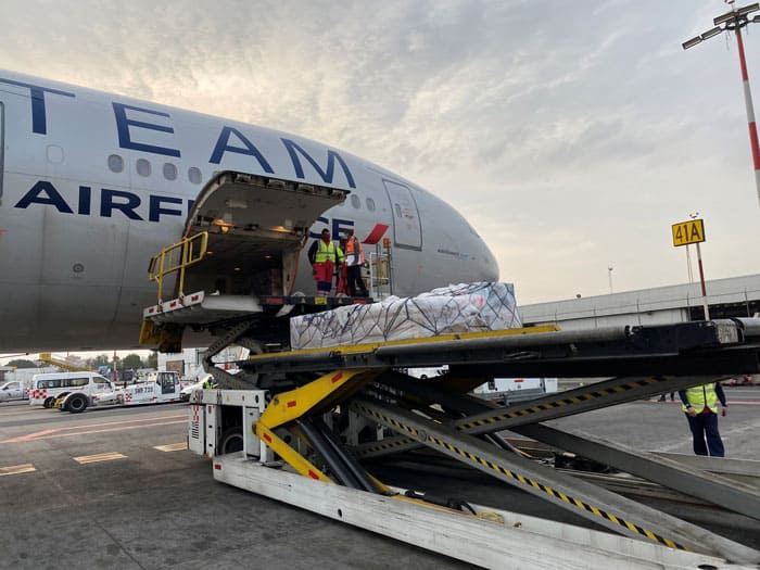 Workers unload a batch of the first shipment of doses of the COVID-19 vaccine by German biotech firm CureVac that arrived for Phase III clinical trials at Benito Juarez International Airport in Mexico City Jan. 27, 2021. (CNS photo/Mexico's Foreign Ministry handout via Reuters)