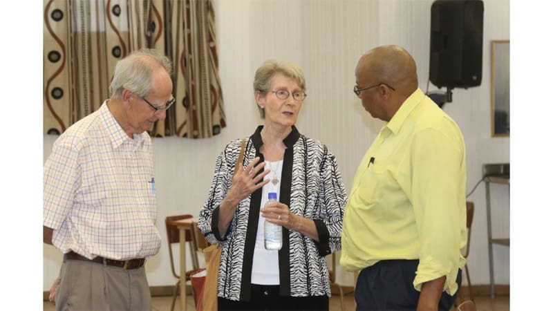 At the launch of the book The Scourge of Human Trafficking: Modern-Day Slavery, editor Sister Janice McLaughlin converses with E. Geoghegan (left), AFCAST financial advisor, and Z. Godi, a member of the AFCAST Working Group to Combat Human Trafficking. (Courtesy of AFCAST/Zimbabwe)