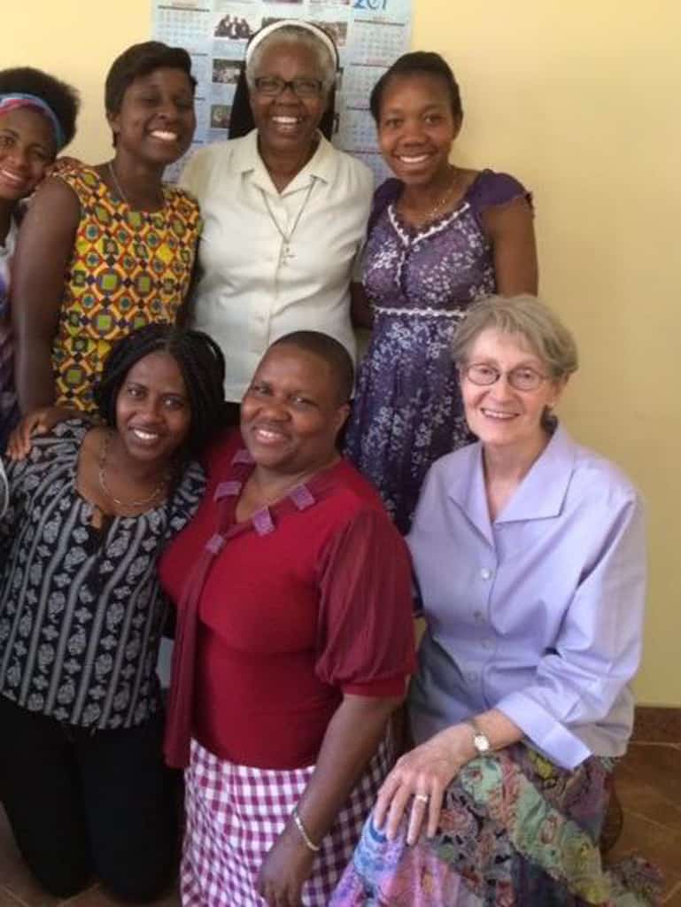 Survivors of human trafficking pose with Maryknoll Sister Janice McLaughlin (seated, right), Dadirai Chikwekwete (red blouse) and Dominican Sister Tendai Makonese (white blouse), the director of Lifelines, a media production company, during the recording Sister Makonese directed of a short video on human trafficking that is on the AFCAST website. (Courtesy of AFCAST/Zimbabwe)