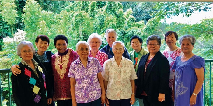 Sister-Ardis-3 Sister Ardis Kremer (back, center) poses with members of the Maryknoll Sisters congregation who were serving in Hawaii. (Courtesy of the Maryknoll Sisters)