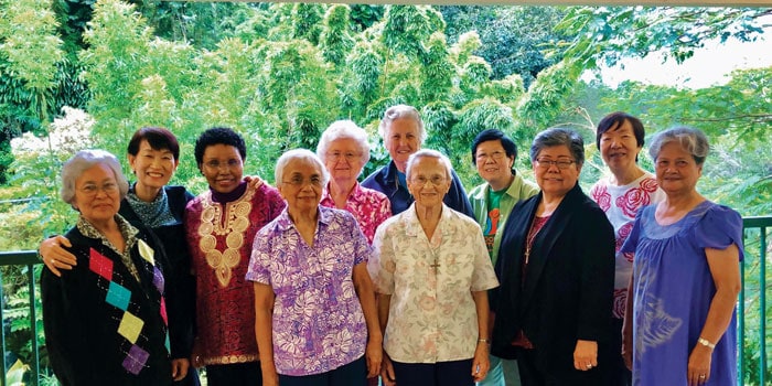 Sister Ardis Kremer (back, center) poses with members of the Maryknoll Sisters congregation who were serving in Hawaii. (Courtesy of the Maryknoll Sisters)