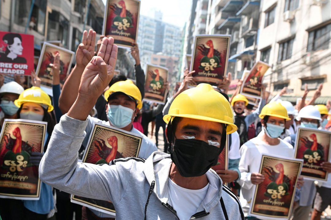 Demonstrators flash the three-finger salute March 1, 2021, during a protest against the military coup in Yangon, Myanmar. (CNS photo/Reuters)