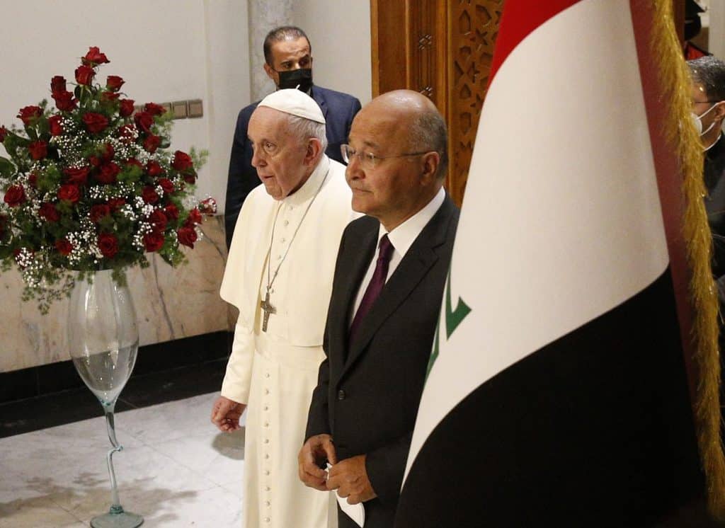 Pope Francis and Iraqi President Barham Salih arrive for a meeting with authorities, civil society leaders and members of the diplomatic corps in the hall of the presidential palace in Baghdad, Iraq, March 5, 2021. (CNS photo/Paul Haring