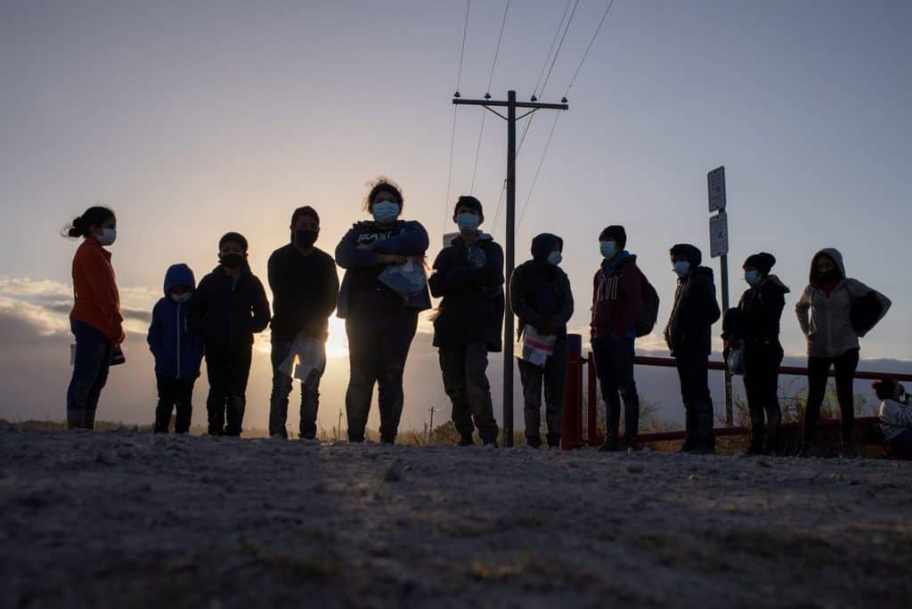 Unaccompanied minors seeking asylum in the U.S., await transport in Penitas, Texas, March 12, 2021, after crossing the Rio Grande River. (CNS photo/Adrees Latif, Reuters)