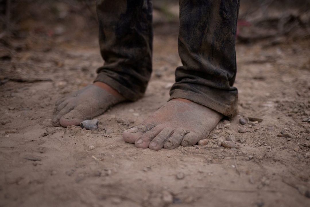 MEXICO U.S. MIGRATION A migrant's bare feet are seen in La Joya, Texas, March 14, 2021, after the migrant crossed the Rio Grande River. (CNS photo/Adrees Latif, Reuters)