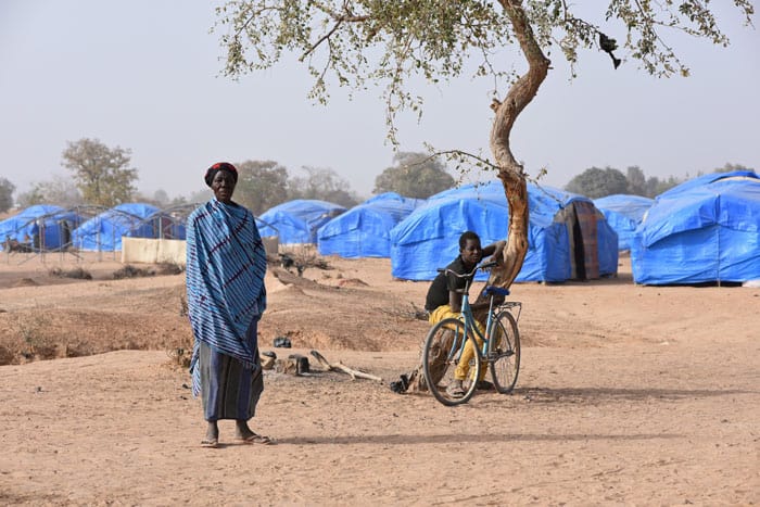 A displaced woman and young man are seen at a camp in Pissila, Burkina Faso, Jan. 24, 2020. Parts of Yemen, South Sudan, Burkina Faso and Nigeria are close to or already facing famine. Other countries face severe food insecurity or worse. (CNS photo/Anne Mimault, Reuters)