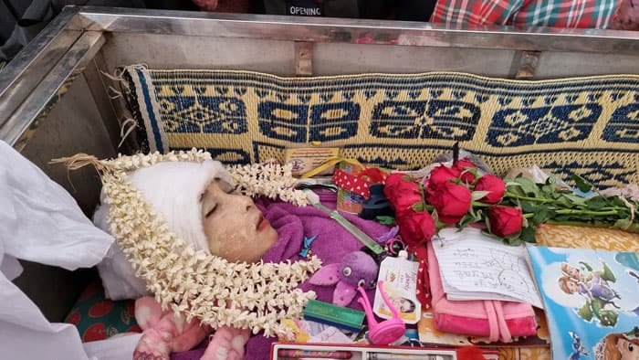 After Bloody Saturday, Myanmar Catholics Pray The body of 11-year-old Aye Myat Thu is pictured during her funeral March 28 in Mawlamyine, Myanmar. The girl was shot and killed March 27 as riot police and anti-coup protesters clashed in Mawlamyine. (CNS photo/Reuters)