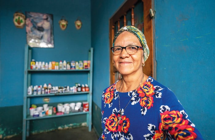 Angelina Enamorado at her home that also serves as a drop-in medical clinic and store in Barrio Chamelecón, a neighborhood of San Pedro Sula, Honduras. (Gregg Brekke/Honduras)