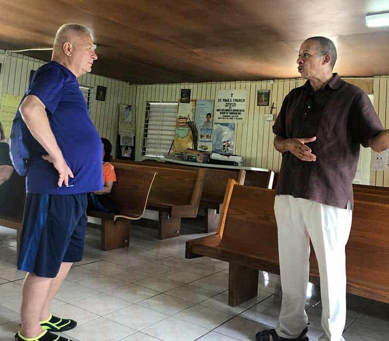 After World Mission Sunday Mass at St. Ferdinand Church, pastor Father Jason Torba and Cardinal Blase Cupich greet the congregation, including all those who do mission in Chicago. (Julie Jaidinger, Chicago Catholic/U.S.)