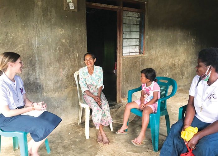 Maryknoll Sisters Julia Shideler (left) and Susan Wanzagi (right) visit homes and listen to the concerns of their neighbors in Aileu. (Courtesy of Susan Wanzagi/East Timor)