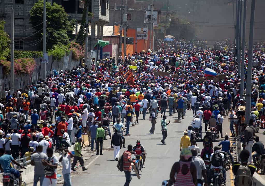 Demonstrators march during a protest against the government of Haitian President Jovenel Moïse in Port-au-Prince March 28, 2021. (CNS photo/Estailove ST-Val, Reuters)