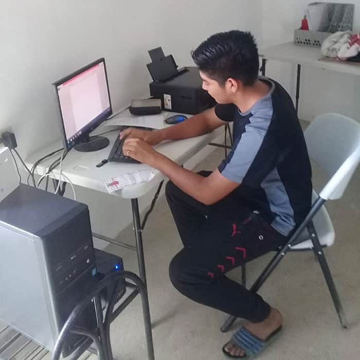 Web-Only-Dixon-01 Jonathan, a salvadoran high school student who wants to become a doctor, studies at La Esperanza community library. (Courtesy of MKLM/El Salvador)
