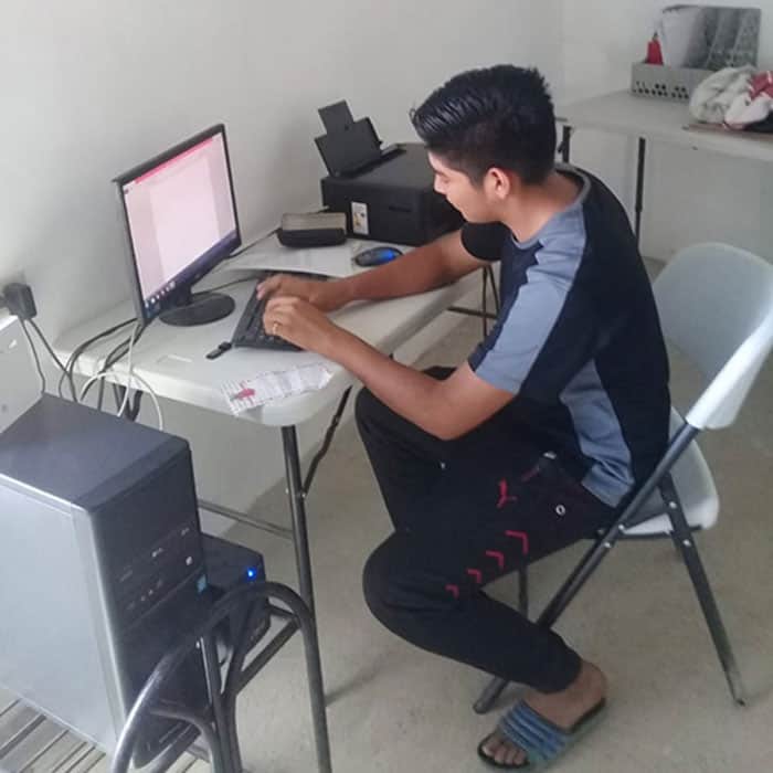 Jonathan, a salvadoran high school student who wants to become a doctor, studies at La Esperanza community library. (Courtesy of MKLM/El Salvador)