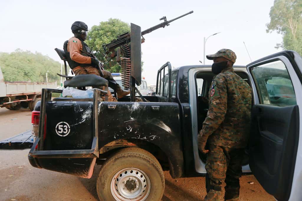 A soldier sits with his weapon on a pickup truck in Zamfara, Nigeria, March 2, 2021.Catholic and Muslim leaders are working jointly to deter youth from terrorist violence in Africa's Sahel region. (CNS photo/Afolabi Sotunde/Reuters)