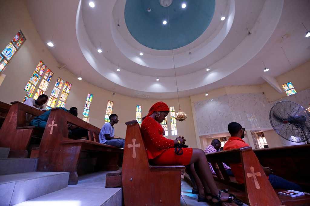 Worshippers pray during a March 22, 2020, Mass at St. Gabriel Catholic Church, in Abuja, Nigeria, as African governments struggle to control the spread of the coronavirus (COVID-19). (CNS photo/Afolabi Sotunde, Reuters)