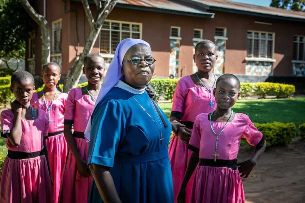 Sister Annunciata Chacha, a member of the Immaculate Heart Sisters of Africa, poses with girls from the Jipe Moyo shelter in Musoma, Tanzania. (CNS photo/Jerry Fleury, Maryknoll Lay Missioners)