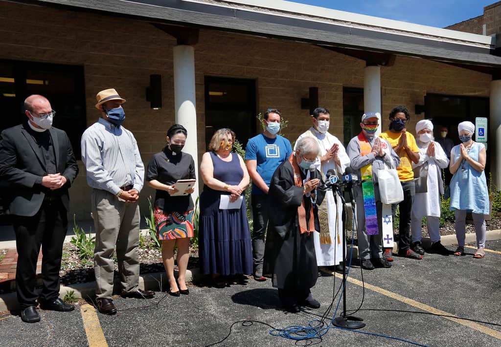 stop AAPI hate- Rev. Patti Nakai of the Buddhist Temple of Chicago leads a prayer during an interfaith rally against racism toward Asian Americans and Pacific Islanders May 2, 2021. (CNS photo/Karen Callaway, Chicago Catholic)