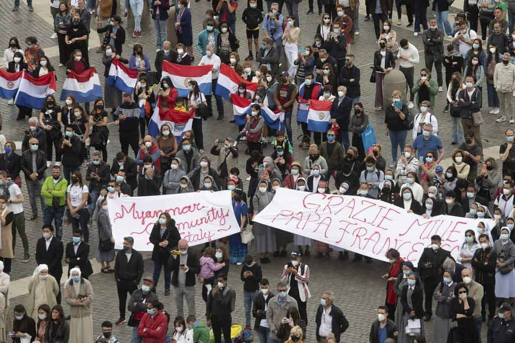 Members of the Myanmar community hold banners in St. Peter's Square as they attend the recitation of the "Regina Coeli" led by Pope Francis from the window of his studio overlooking the square at the Vatican May 17, 2021. (CNS photo/Vatican Media)