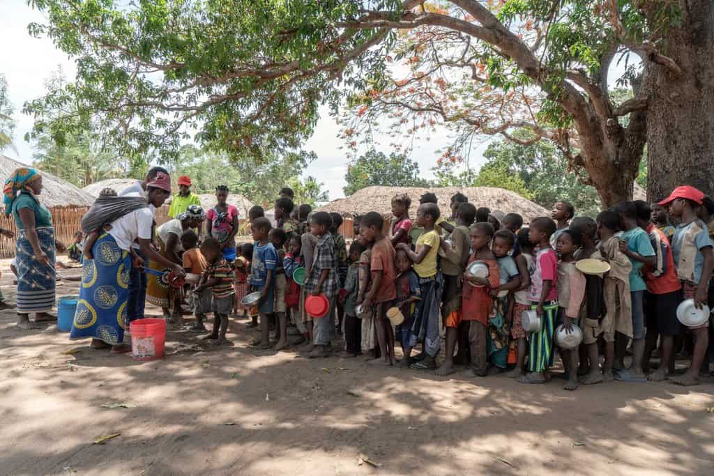DISPLACED CAMP MOZAMBIQUE Displaced people gather in a camp in Mozambique's Cabo Delgado province in this 2019 photo. Residents in northern Mozambique, a region rich in natural gas deposits, have been grappling with an Islamist insurgency since 2017. (CNS photo/Alessandro Grassani, courtesy AVSI)