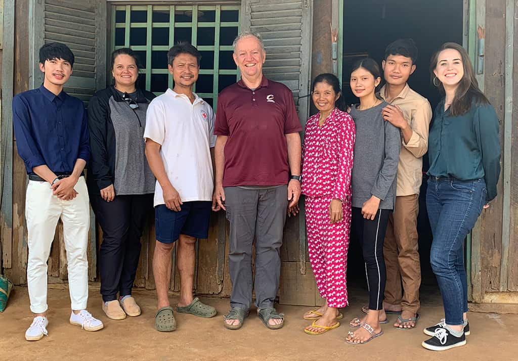 Julie Lawler, second from left, at the home of one of the staff members of the Maryknoll Mental Health project on New Year’s Day 2021 with Maryknoll priest associate, Father Kevin Conroy, and fellow Maryknoll Lay Missioner Kylene Marie Fremling. (Courtesy Julie Lawler/Cambodia) With article One Year In: Reflecting on the Gifts of the Holy Spirit