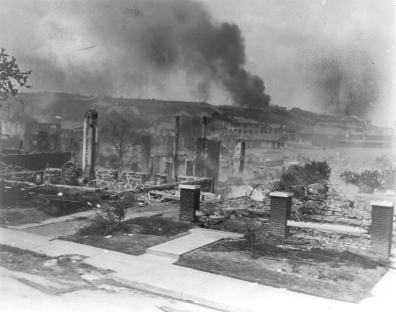 TULSA RACE MASSACRE OF 1921 Smoke rises from the ruins of African Americans' homes following the 1921 race massacre in Tulsa, Okla. (CNS photo/Alvin C. Krupnick Co., National Association for the Advancement of Colored People Records, Library of Congress, Handout via Reuters)