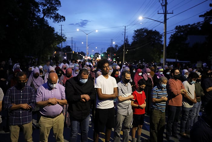 ONTARIO MUSLIMS DEADLY ATTACK After World Mission Sunday Mass at St. Ferdinand Church, pastor Father Jason Torba and Cardinal Blase Cupich greet the congregation, including all those who do mission in Chicago. (Julie Jaidinger, Chicago Catholic/U.S.)